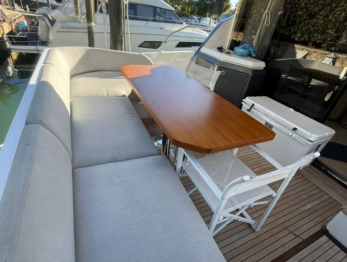 Azimut 53 covered outdoor seating and table