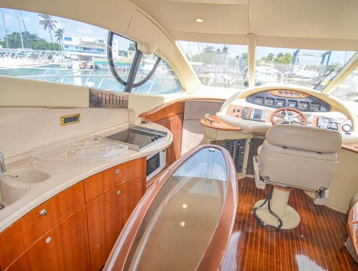 Azimut 55 salon with curved seating and wood finishes