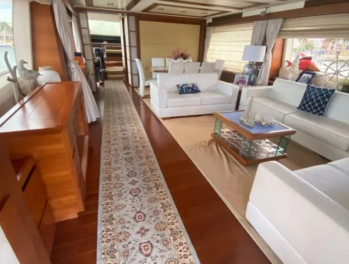 Azimut 86 salon with sofas and warm wood finishes