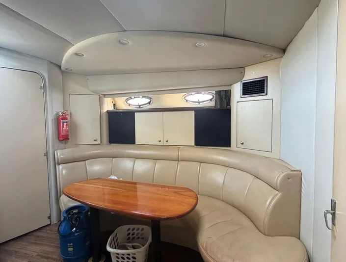 Champagne Girl interior lounge with curved seating and wood finishes
