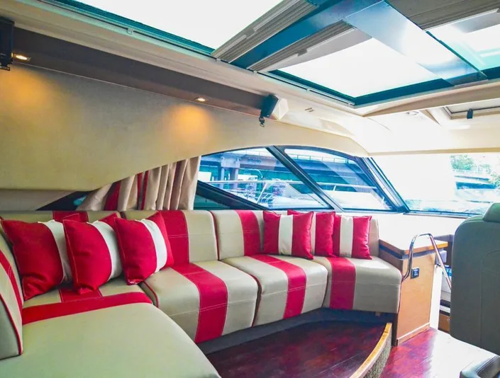 Sea Ray 53 covered seating with red and white cushions