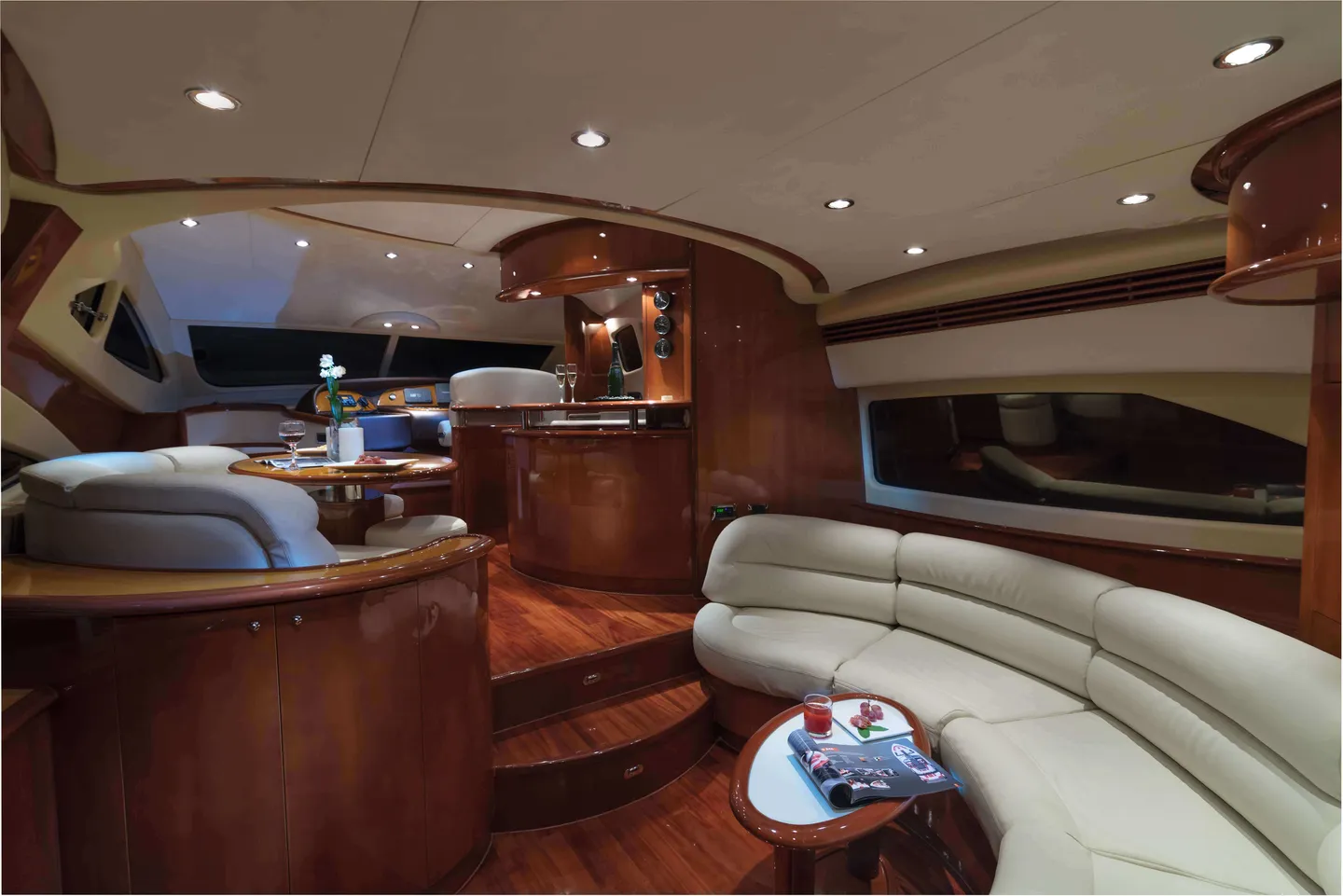 Aicon Fly salon with cream seating and wood finishes