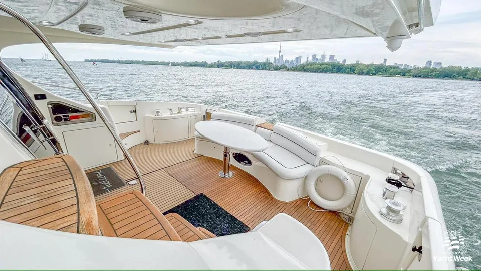 Azimut 62 covered aft deck with oval table