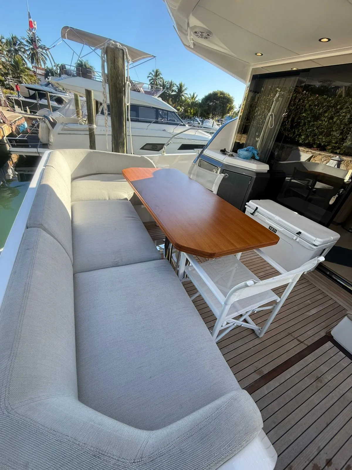 Azimut 53 covered outdoor seating and table