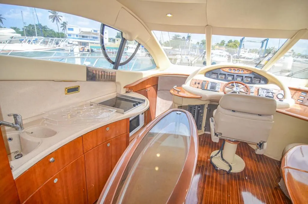Azimut 55 salon with curved seating and wood finishes