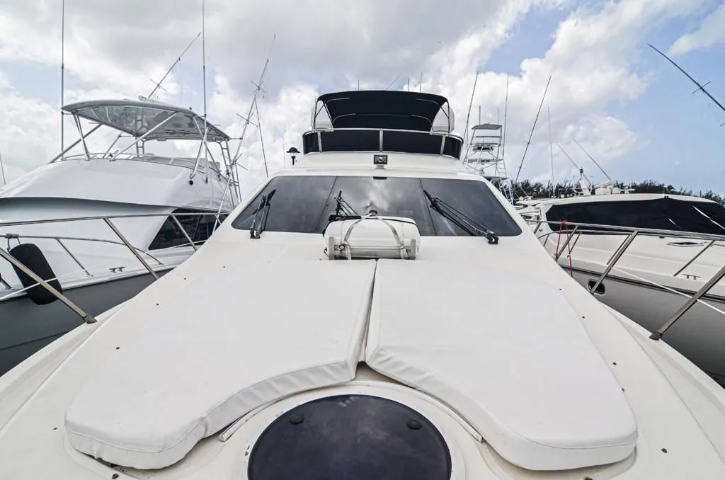 Azimut 55 bow sunbeds with the flybridge behind