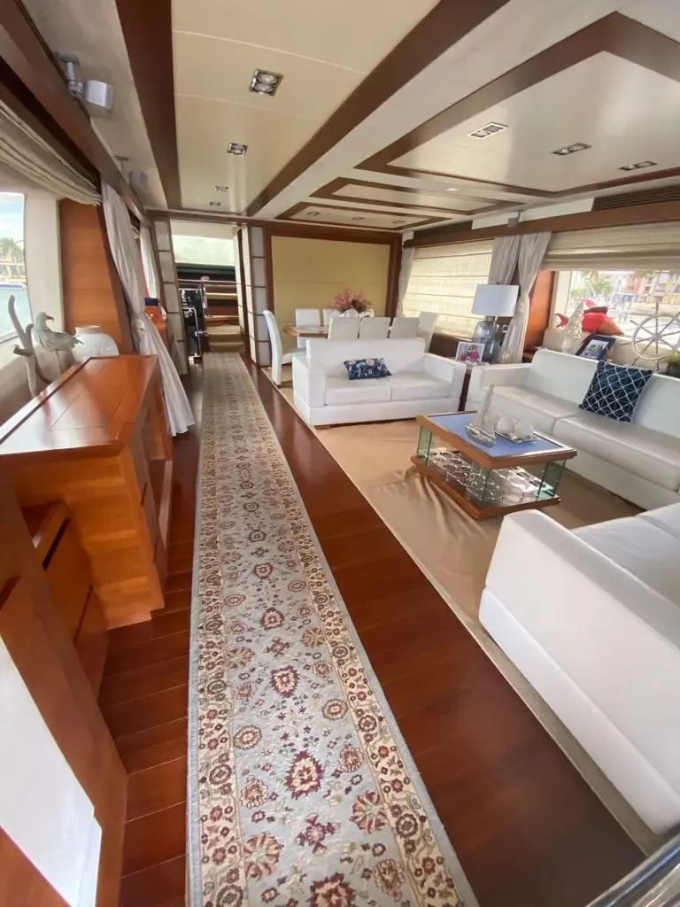 Azimut 86 salon with sofas and warm wood finishes