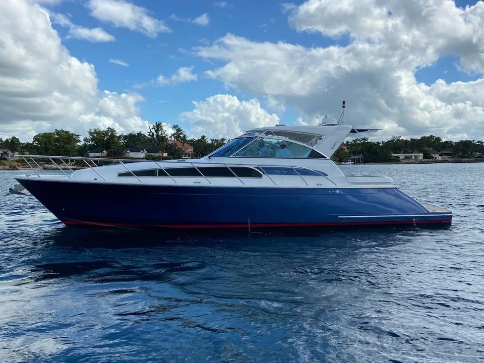 Cris Craft 43 with deep-blue hull and white cabin on the water