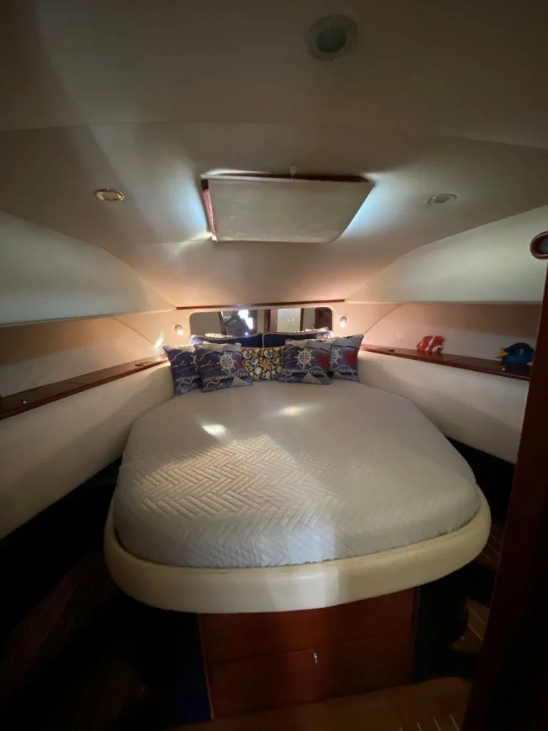 Cris Craft 43 forward double berth beneath an overhead hatch
