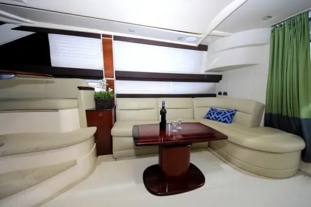 Meridian 42 salon with sofas and warm wood finishes