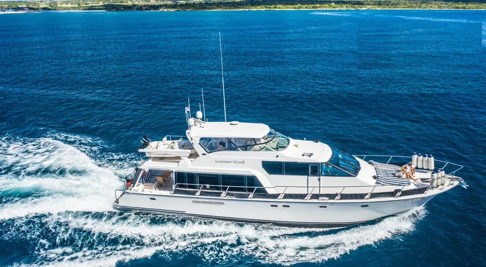 Pacific 72 Summer Wind cruising with blue and white bow sunpads