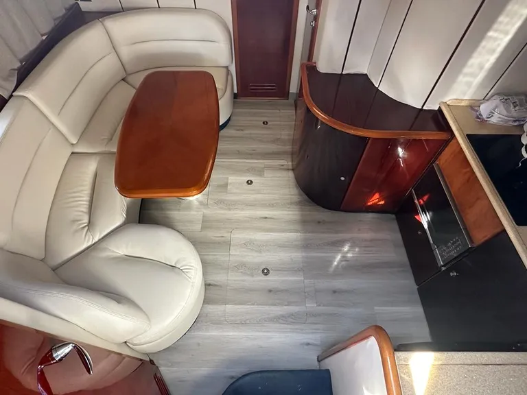 Princess 42 interior lounge with curved seating and wood finishes