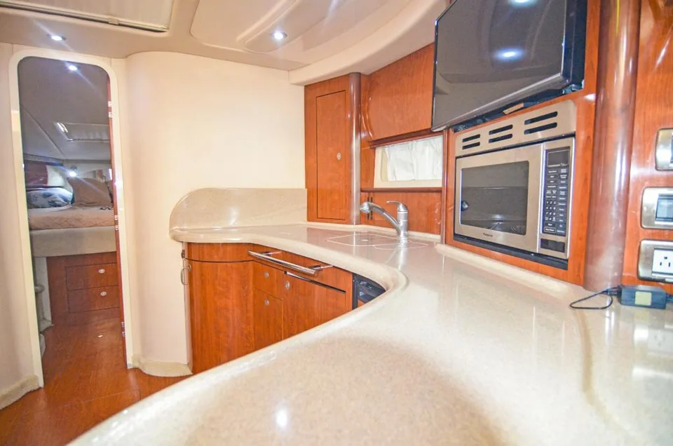 Sea Ray 42 galley with curved worktop, sink and built-in microwave