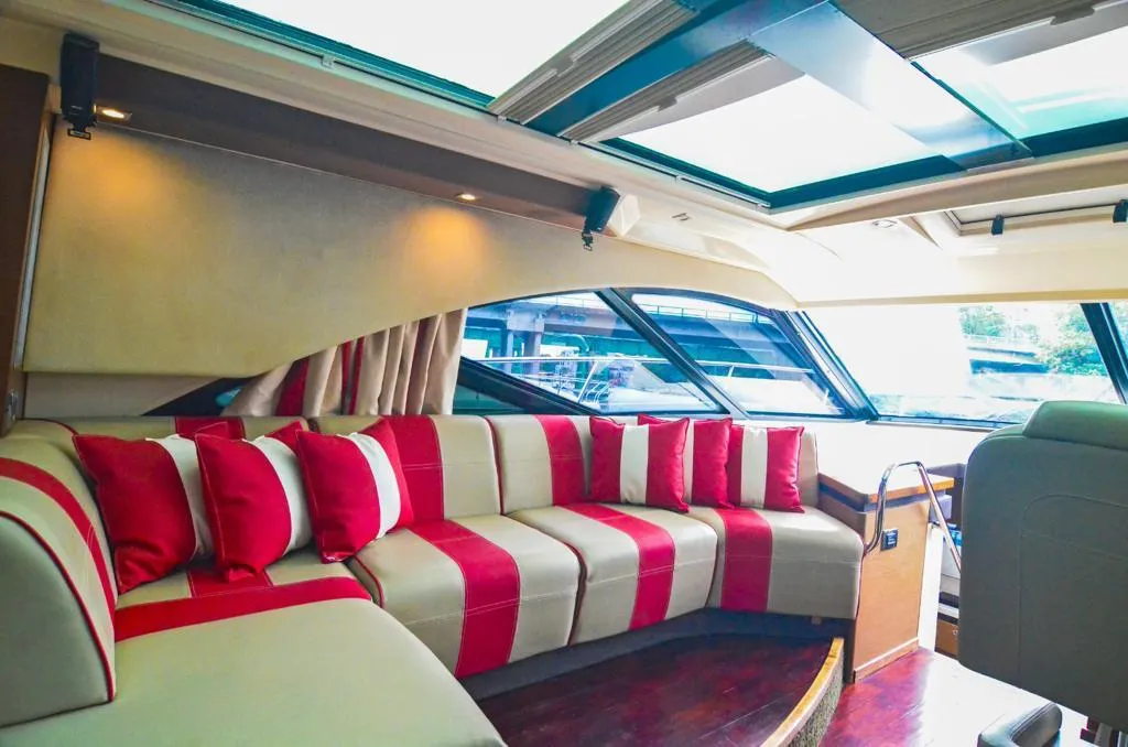 Sea Ray 53 covered seating with red and white cushions