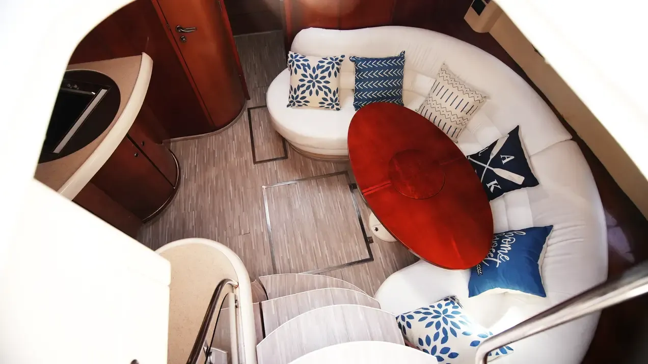 Fairline 43 curved salon seating and dining table